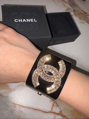 CHANEL Black Cuff Bracelet with Gold Crystal Interlocking Logo
